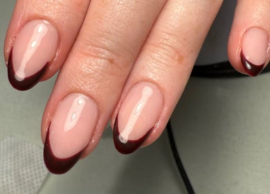 Elegant burgundy-tipped nails from Polished Nails, Portsmouth, England, GB showcasing refined manicure art.