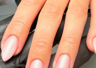 Elegant pink manicure at Polished Nails, Portsmouth, England, GB. A close-up showcasing expert nail styling.