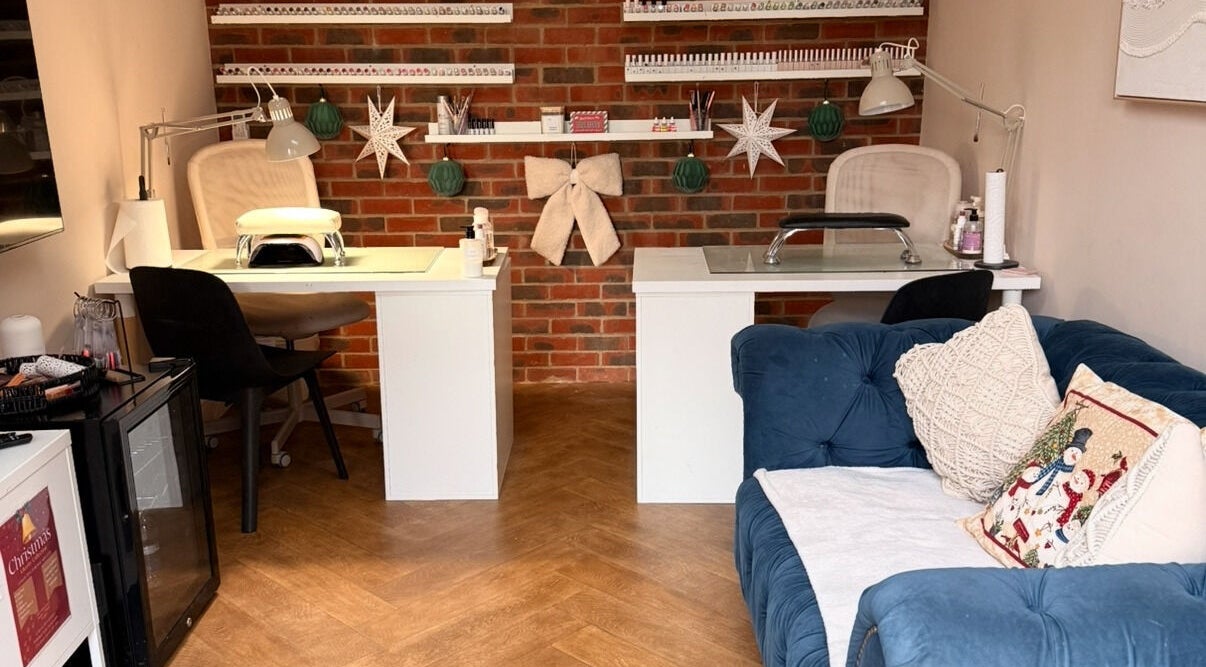 Cozy nail salon at Polished Nails, Portsmouth, England, GB with plush seating and professional manicure stations.