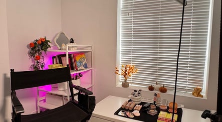 Makeup station at Hmake, Stockport, England, GB adorned with beauty products and decor.