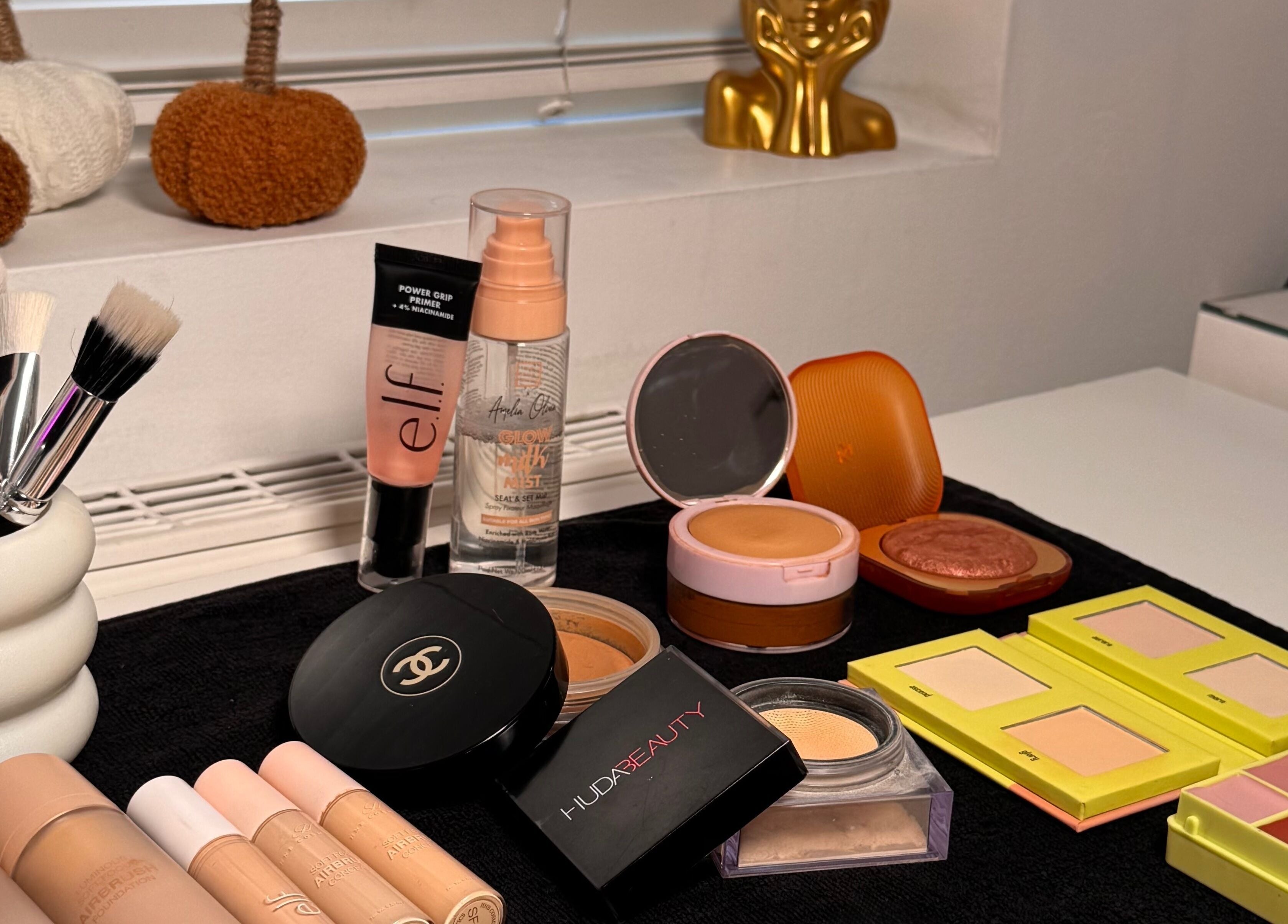 Makeup essentials beautifully displayed at Hmake in Stockport, England, GB, featuring brushes and cosmetics.