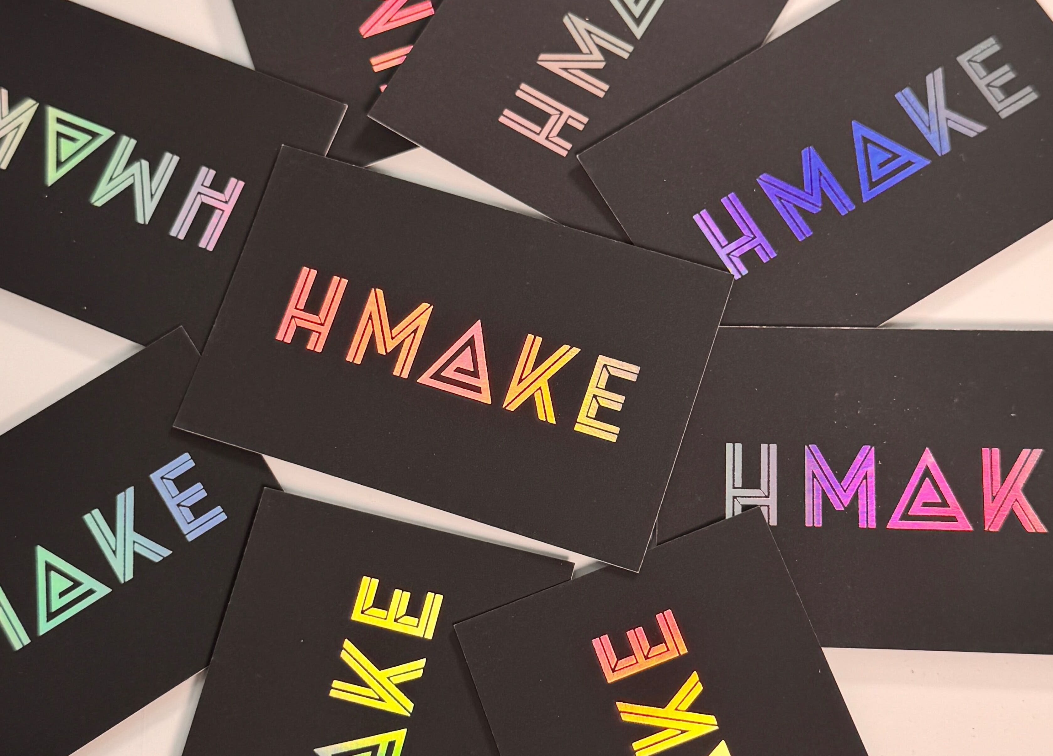Vibrant business cards for Hmake, Stockport, England, GB, showcasing colorful modern design.