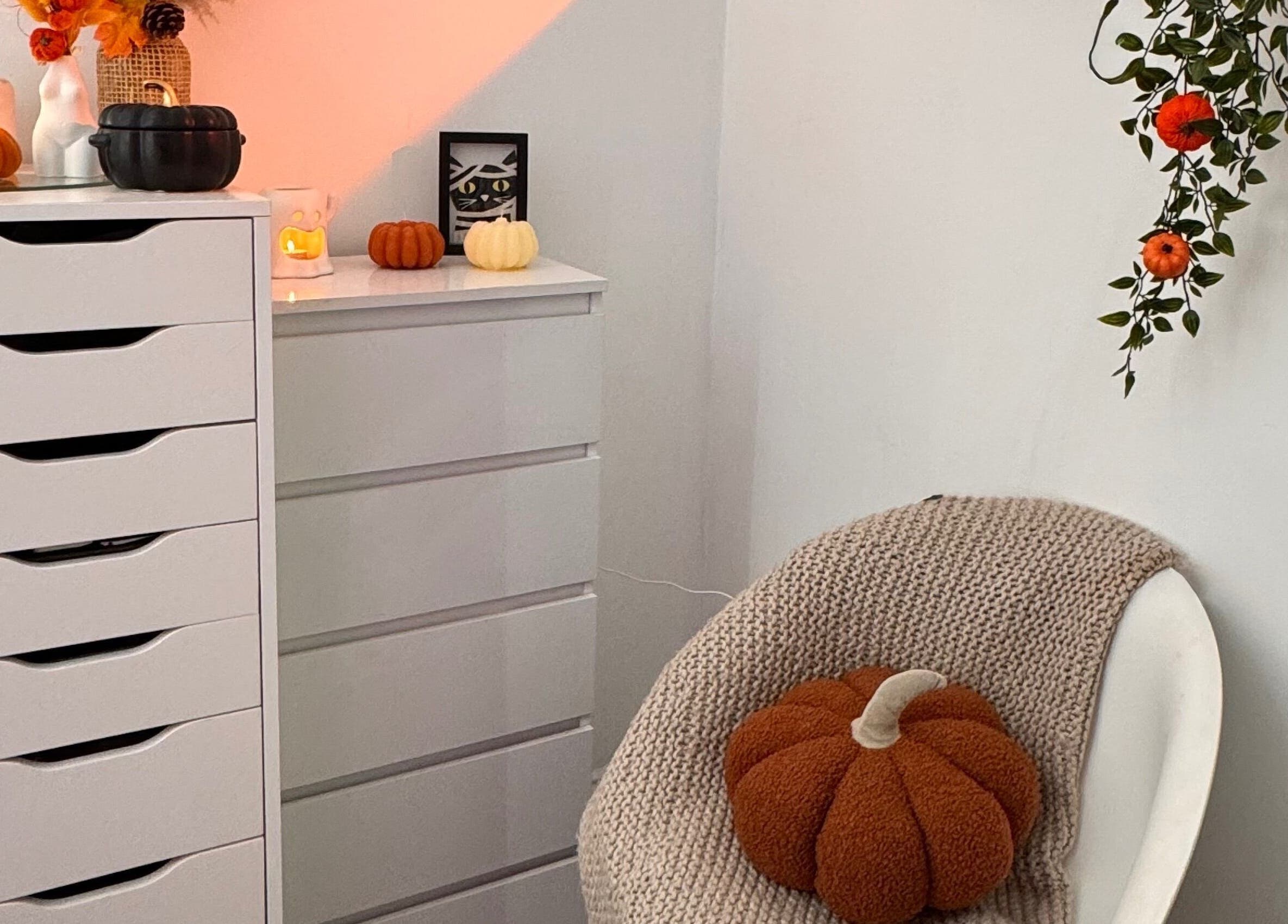 Hmake beauty room in Stockport, England, GB with cozy autumn decor and plush pumpkin in a relaxed setting.