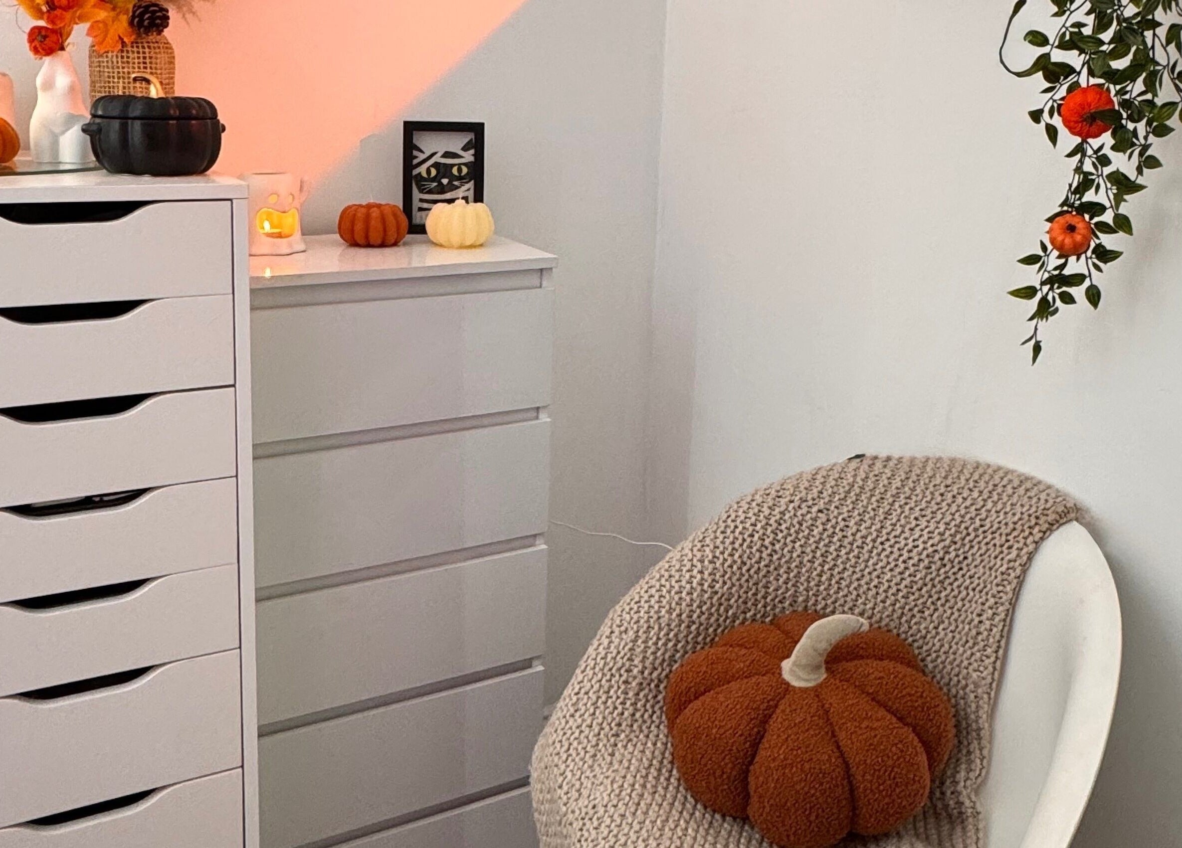Hmake beauty room in Stockport, England, GB with cozy autumn decor and plush pumpkin in a relaxed setting.