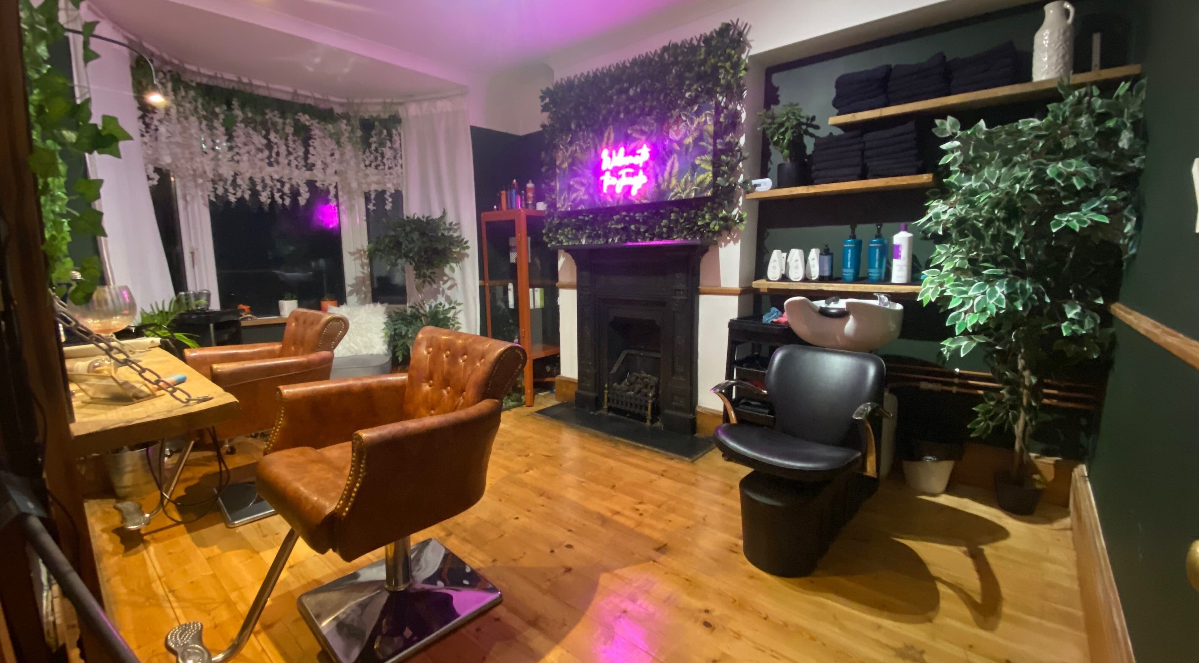 5th Avenue salon interior with chic decor and green plants, Seaton, England, GB.