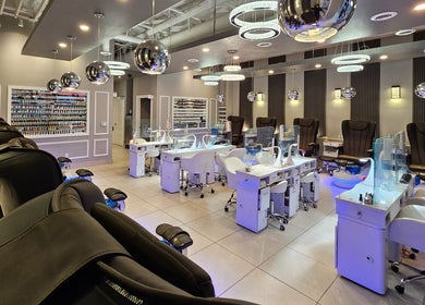 Modern interior of Huron Nail Salon in Kitchener, Ontario, CA with sleek manicure stations and stylish decor.
