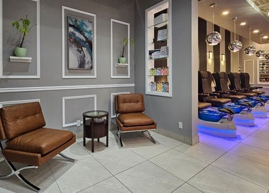 Huron Nail Salon's chic interior in Kitchener, Ontario, CA, featuring modern seating and stylish decor.