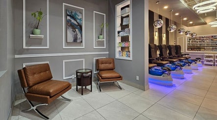 Huron Nail Salon's chic interior in Kitchener, Ontario, CA, featuring modern seating and stylish decor.
