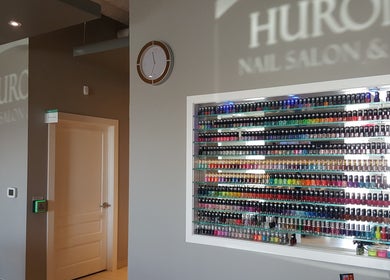 Huron Nail Salon in Kitchener, Ontario, CA displays a vibrant wall of nail polish colors.