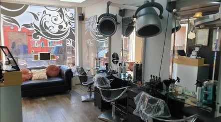 Elegant interior of The Salon in Wigan, GB, featuring modern styling chairs and decorative touches.