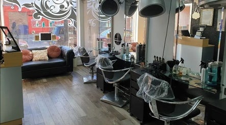 Modern and elegant styling stations at The Salon in Wigan, GB, with chic decor and comfortable seating area.