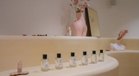 Perfume bottles and decor at Amme, Central, Hong Kong Island, HK, enhancing the calming ambiance.