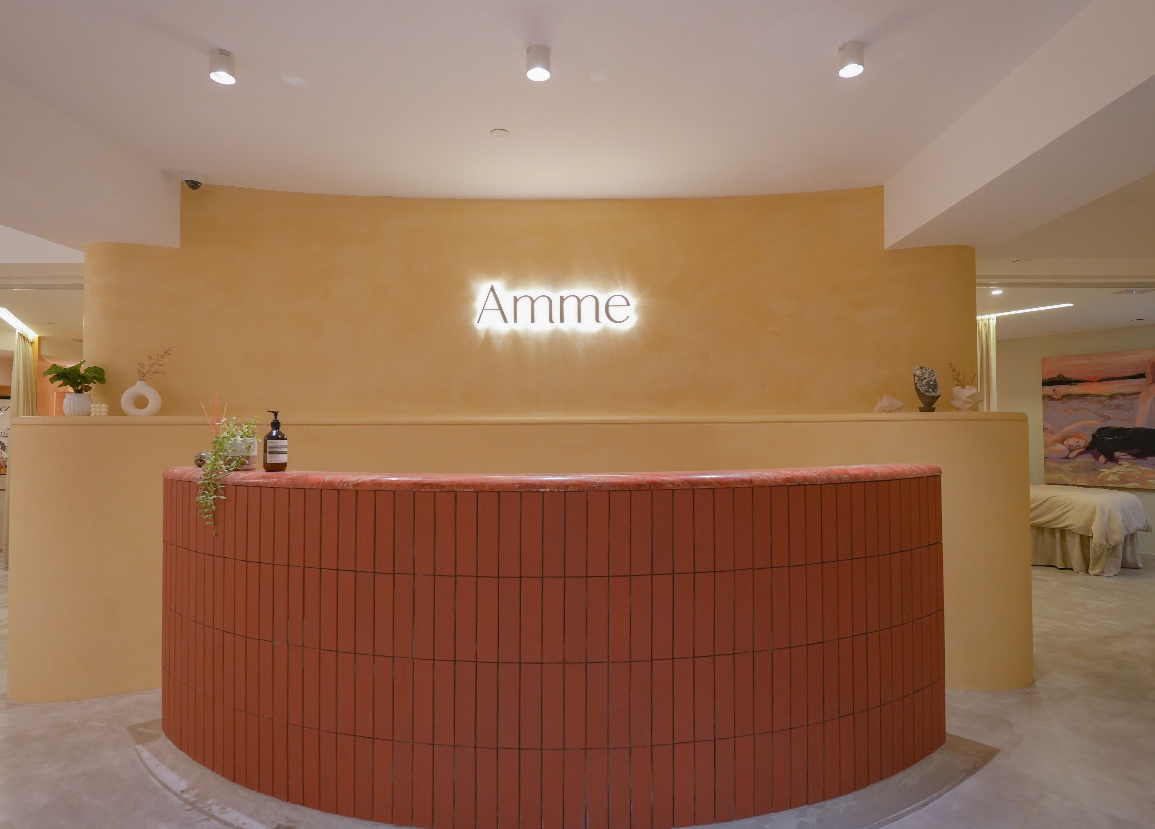 Inviting reception area of Amme with warm lighting in Central, Hong Kong Island, HK.
