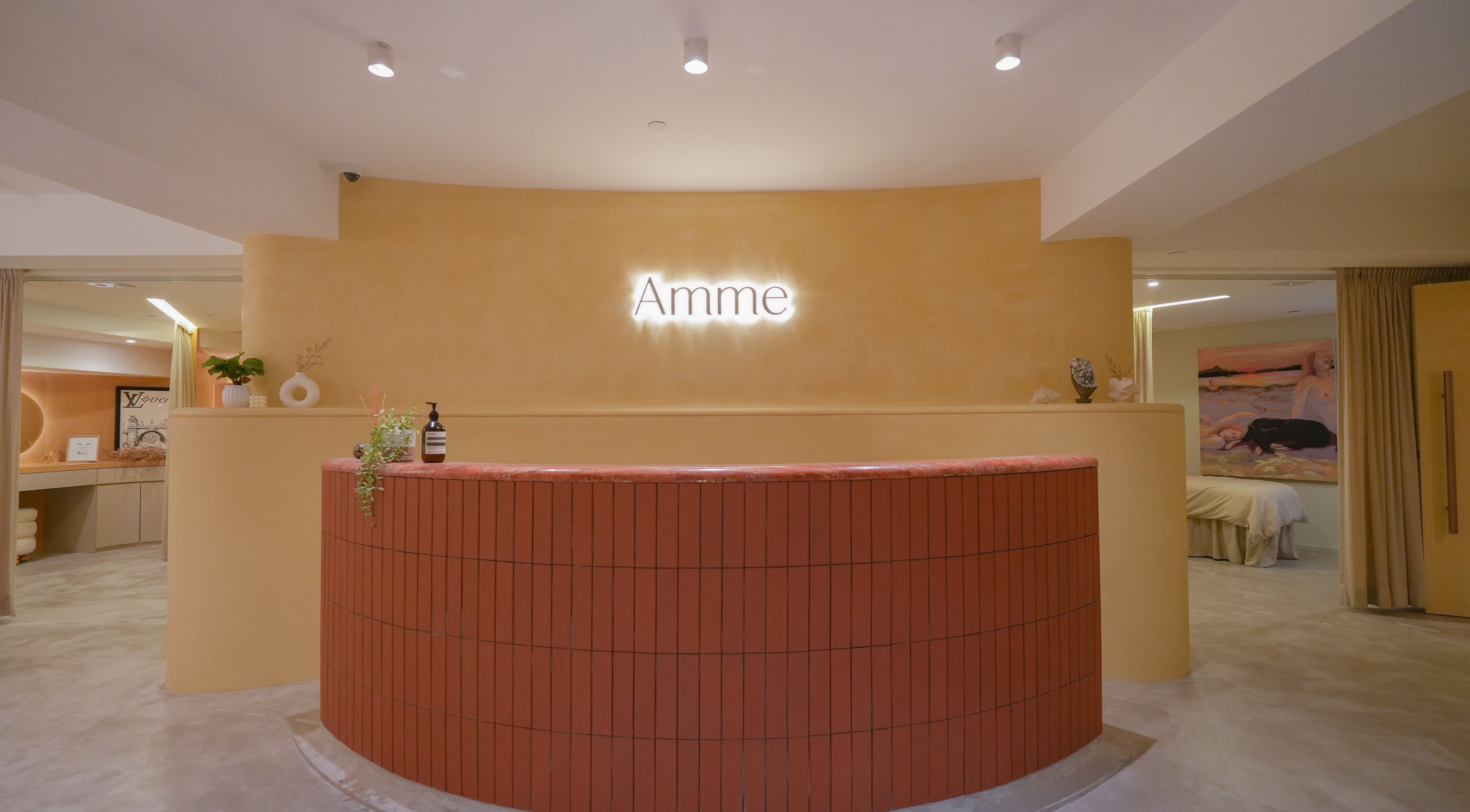 Inviting reception area of Amme with warm lighting in Central, Hong Kong Island, HK.