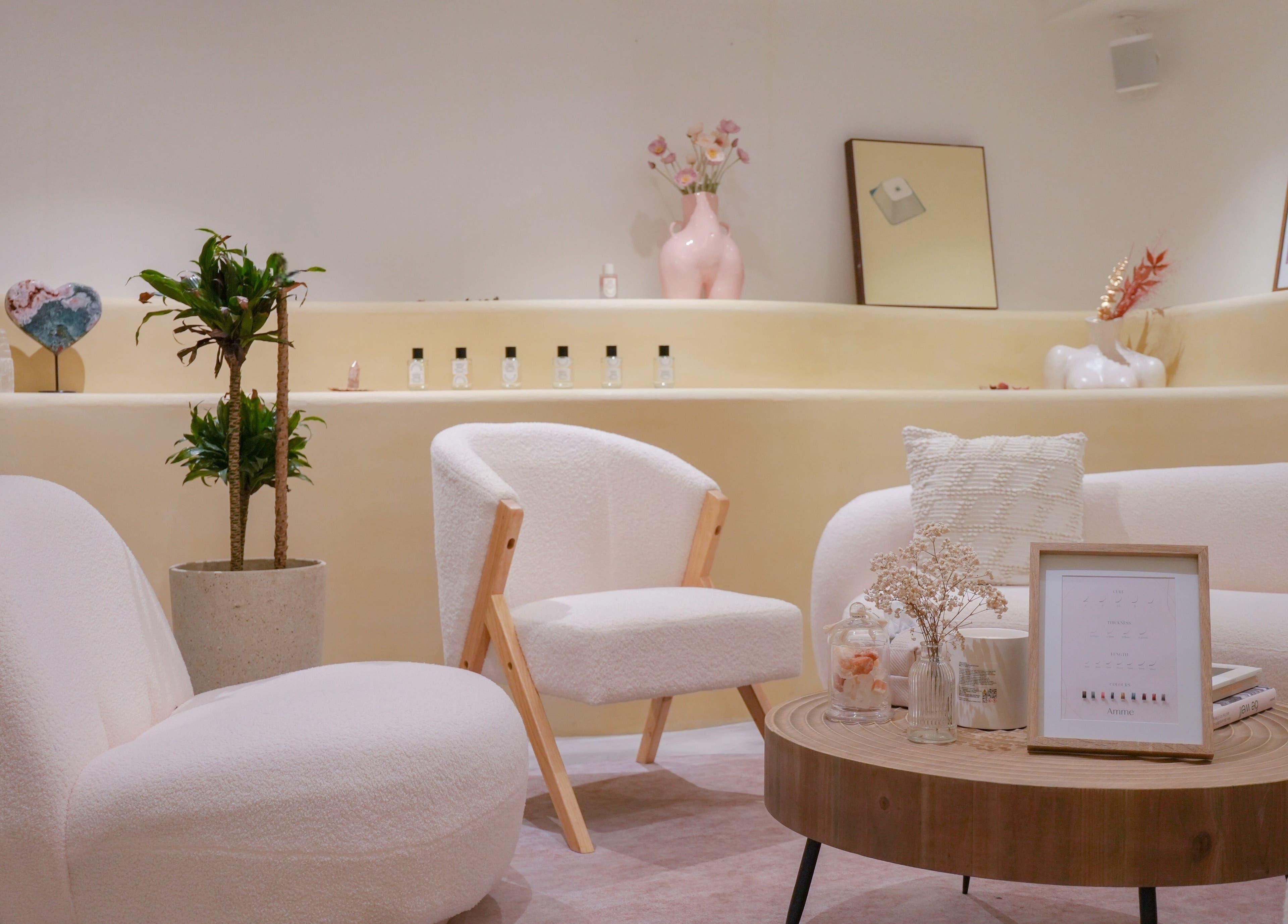 Elegant Amme lounge with plush seating in Central, Hong Kong Island, HK, offering a tranquil beauty experience.