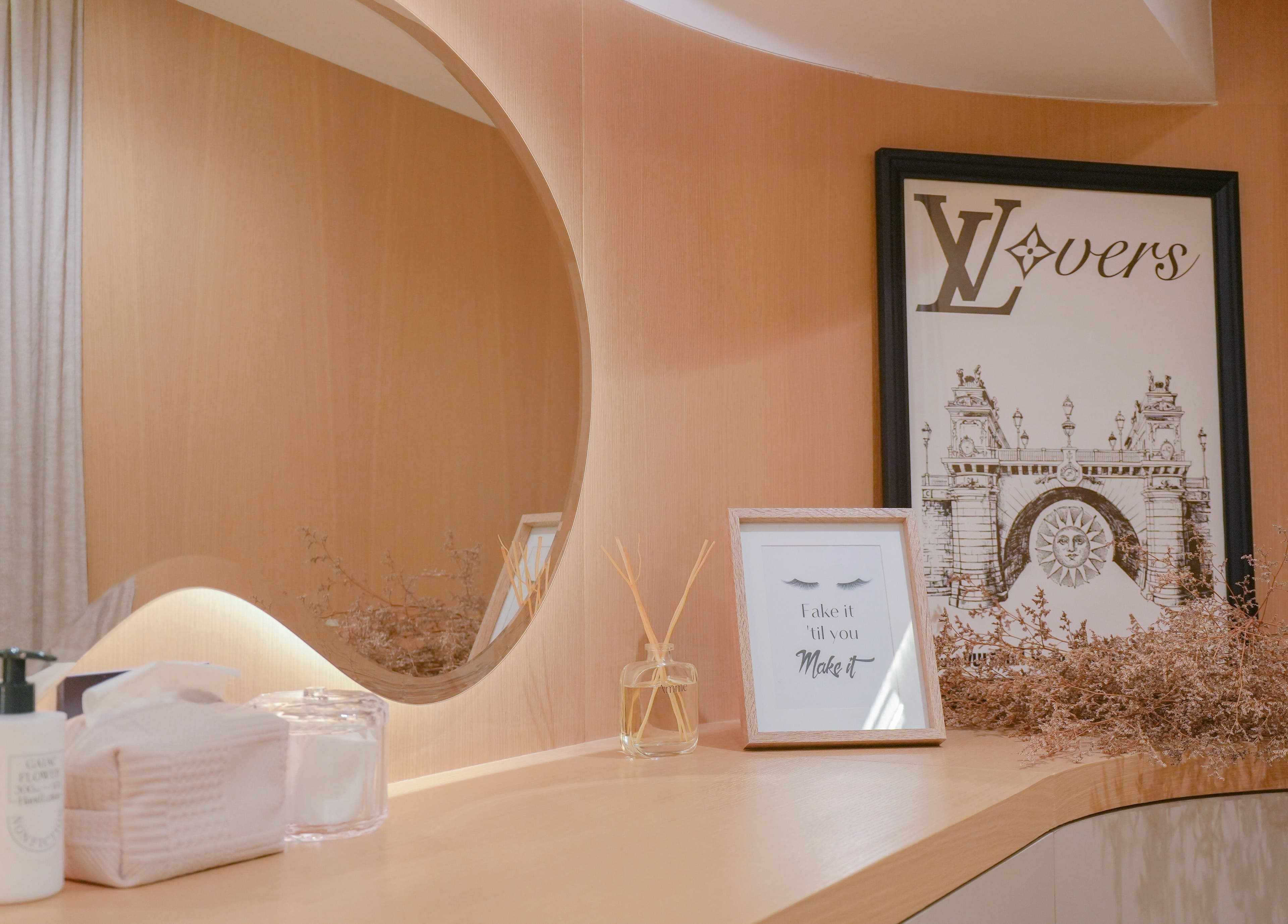 Elegant wooden vanity at Amme, Central, Hong Kong Island, HK, featuring stylish decor and luxurious skincare items.