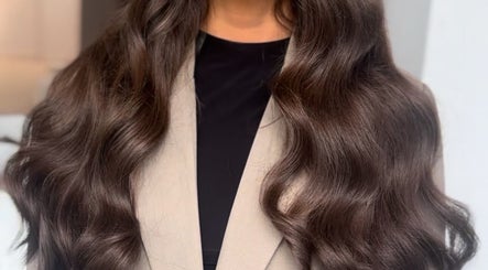 Long, wavy brown hair styled beautifully at Ebony Vallender Hair and Extensions, Portsmouth, England, GB.