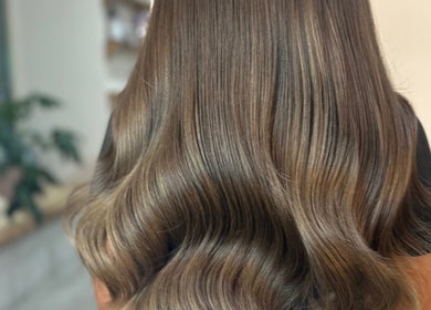 Lustrous brown waves styled at Ebony Vallender Hair and Extensions, Portsmouth, England, GB.