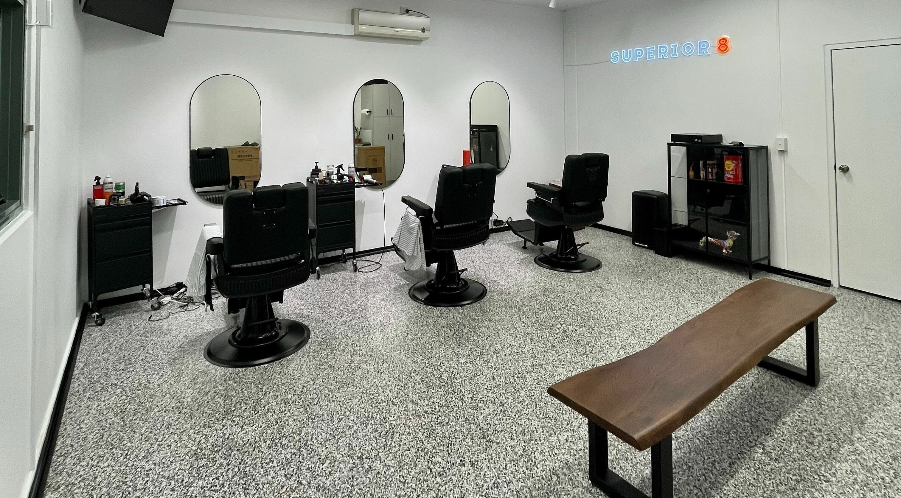 Modern barbershop chairs and mirrors at Superior 8 in Smeaton Grange, New South Wales, AU.