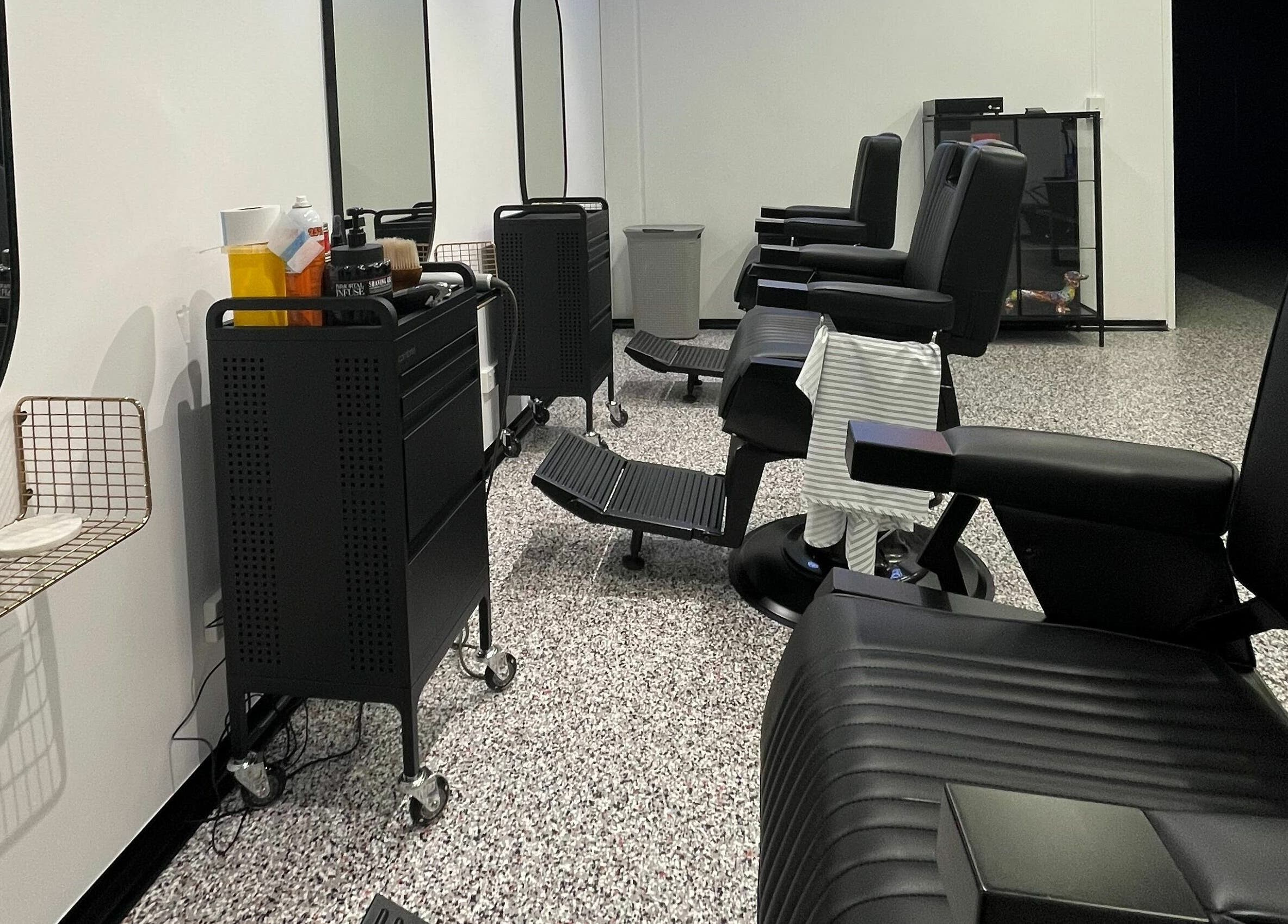 Barber chairs and mirrors at Superior 8, Smeaton Grange, New South Wales, AU. Modern and stylish interior.