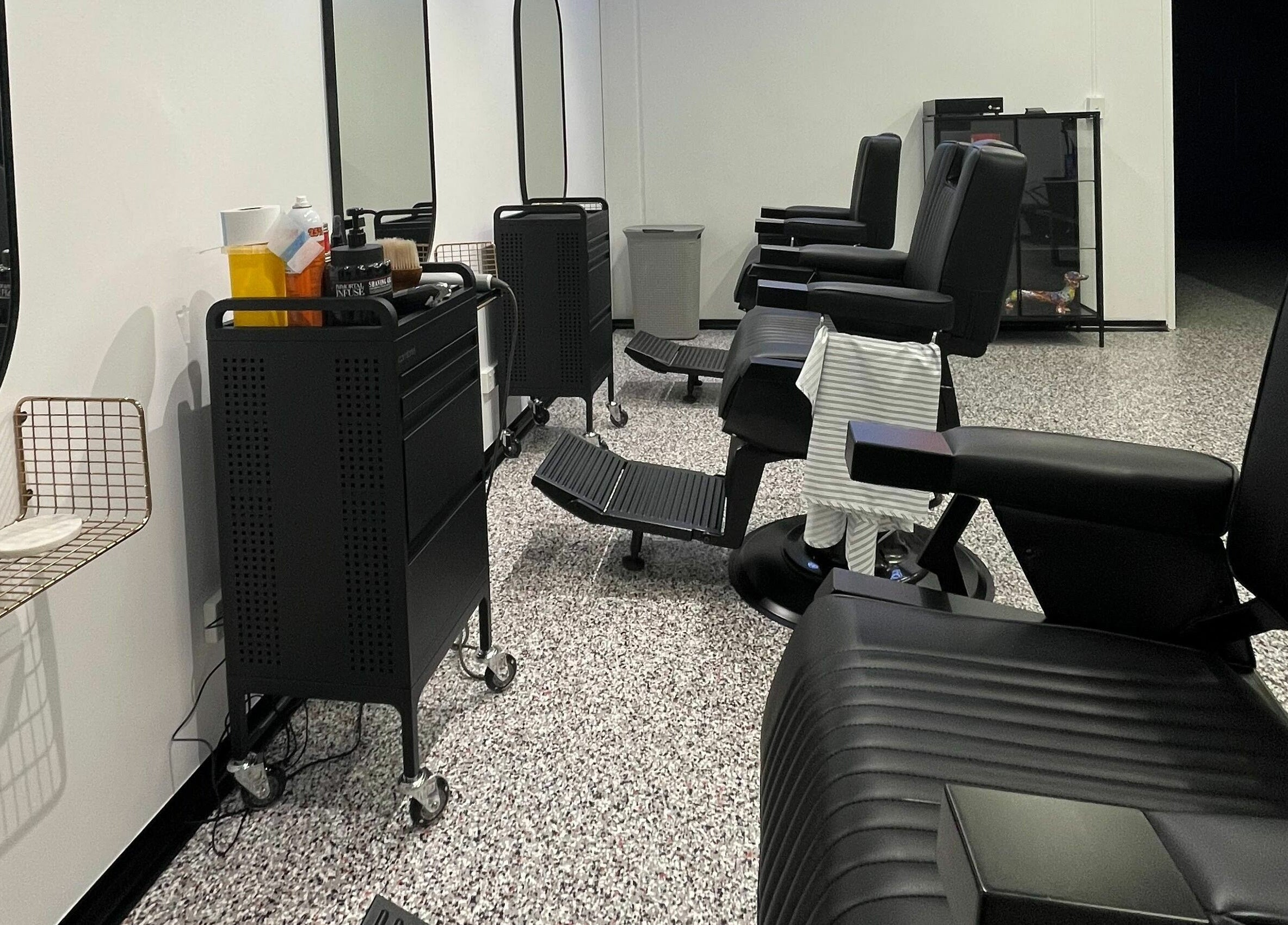 Barber chairs and mirrors at Superior 8, Smeaton Grange, New South Wales, AU. Modern and stylish interior.