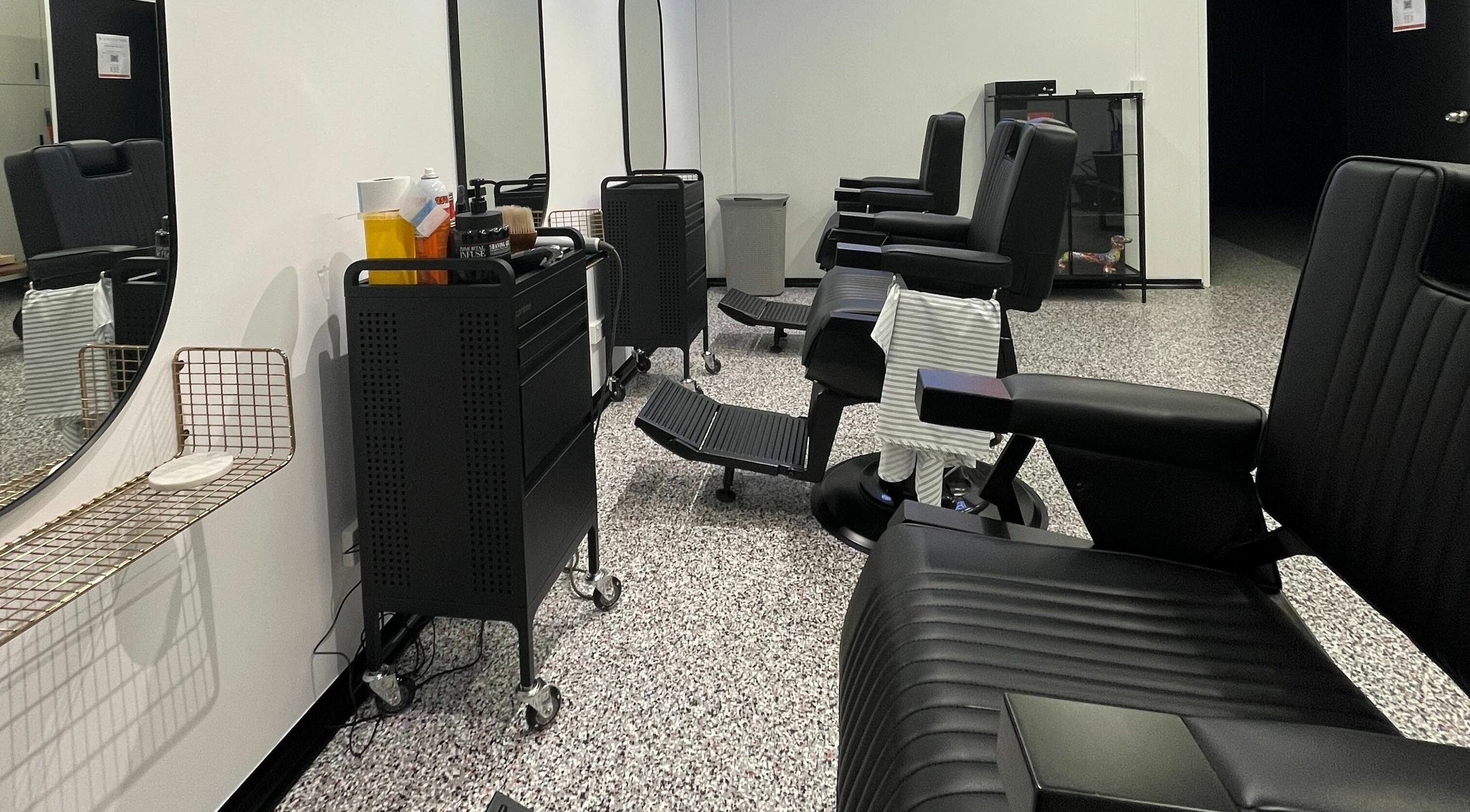 Barber chairs and mirrors at Superior 8, Smeaton Grange, New South Wales, AU. Modern and stylish interior.