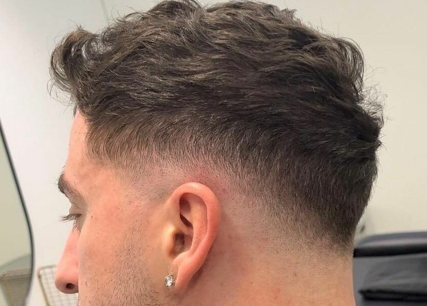 Trendy hairstyle at Superior 8, Smeaton Grange, New South Wales, AU, showcasing a stylish fade.