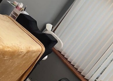 Cozy treatment room at That Beauty Book, Nottingham, England, GB, featuring a comfortable bed and relaxing ambiance.