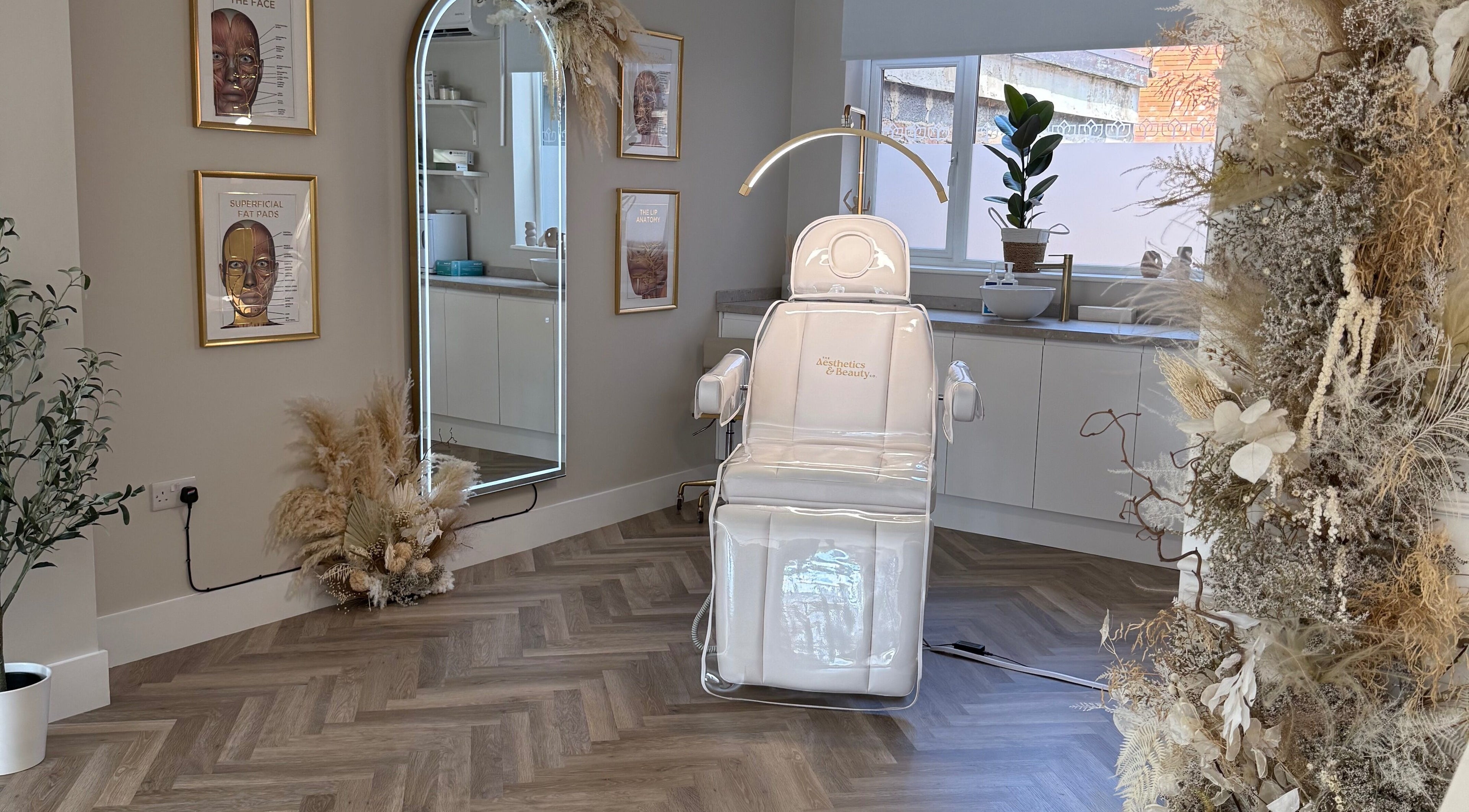 Luxurious treatment room at The Aesthetics And Beauty Co in Beeston, England, GB with sleek decor and modern accents.