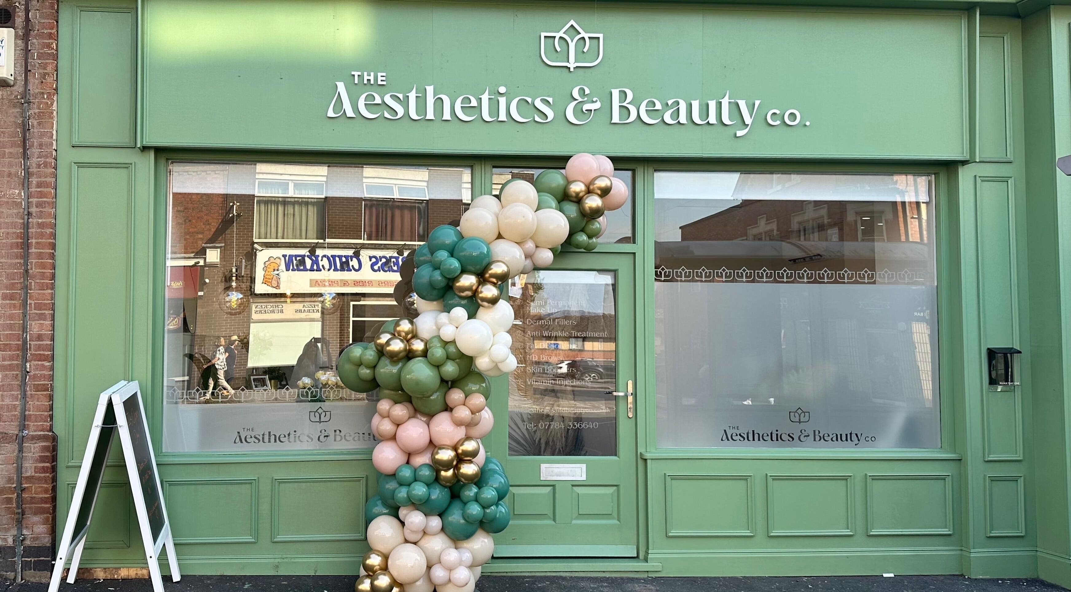 The Aesthetics and Beauty Co - Ilkeston frontage with balloon decor, Ilkeston, England, GB.