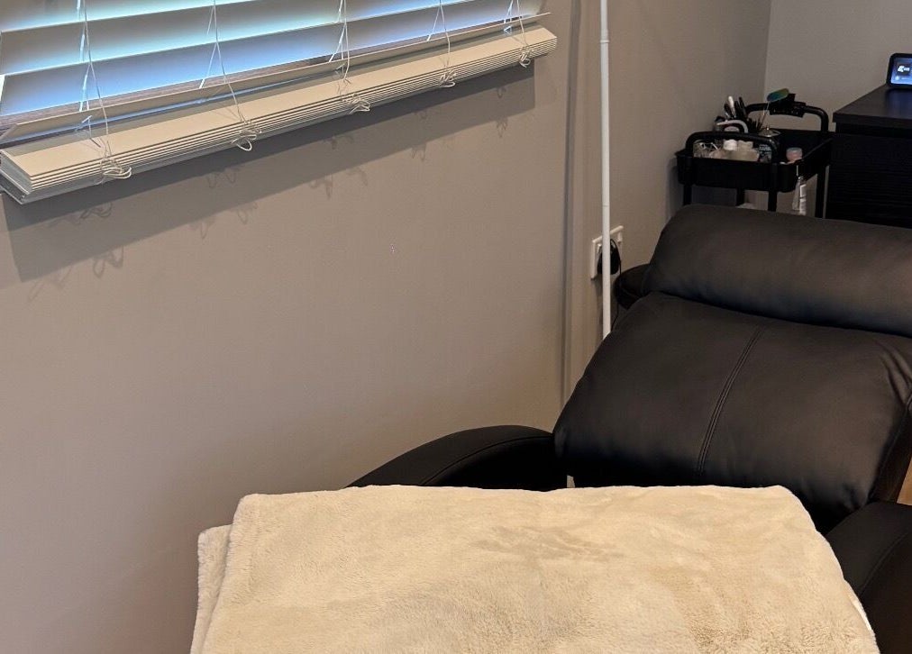 Luxurious treatment room at Bella Beauty, Bowerhill, England, GB with comfortable reclining chair.