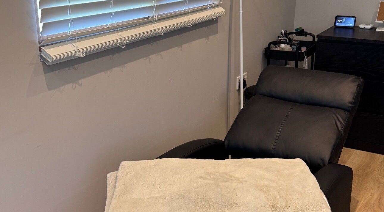 Luxurious treatment room at Bella Beauty, Bowerhill, England, GB with comfortable reclining chair.