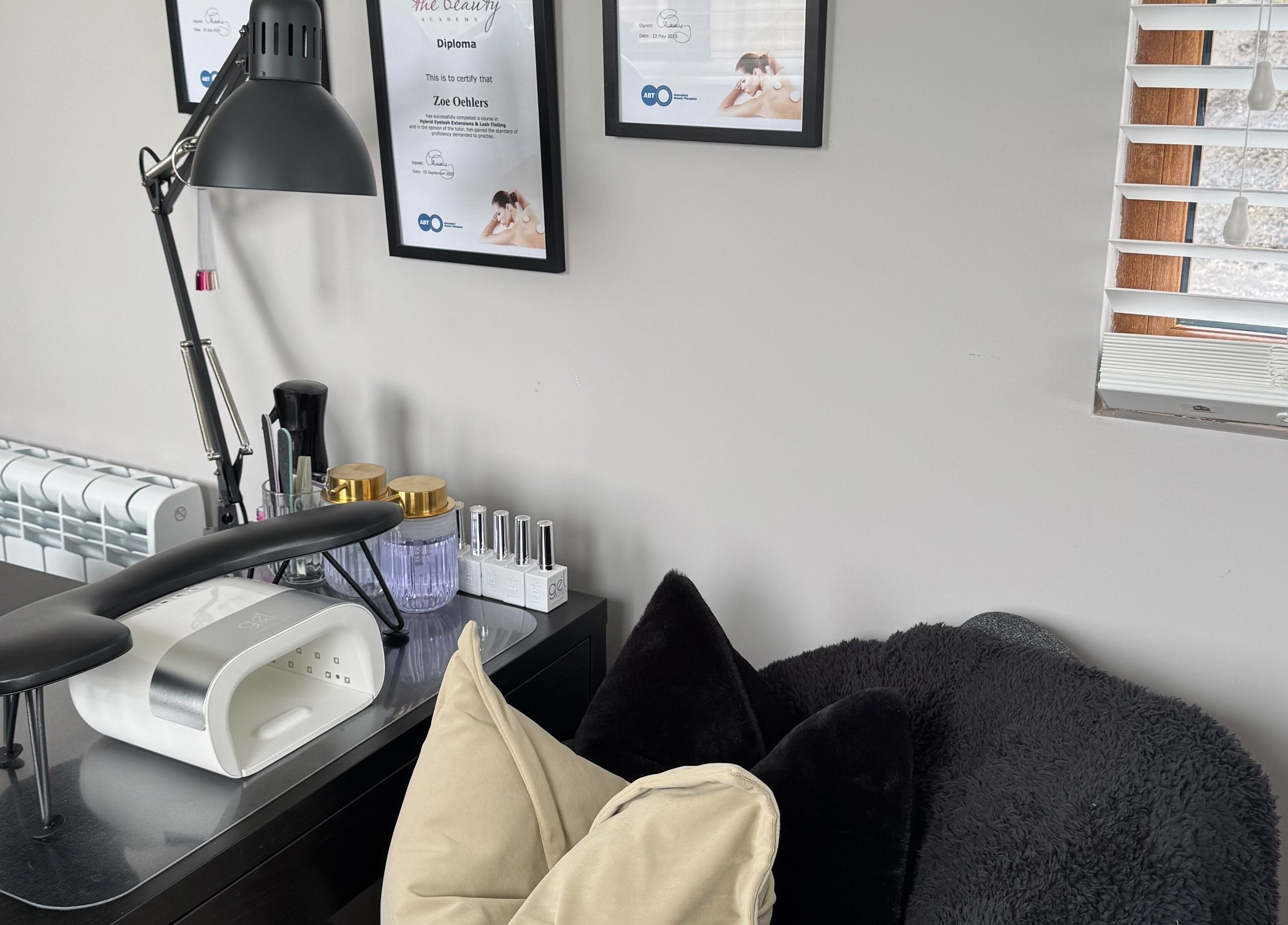 Cozy nail station at Bella Beauty, Bowerhill, England, GB, featuring tools and decor for relaxing services.
