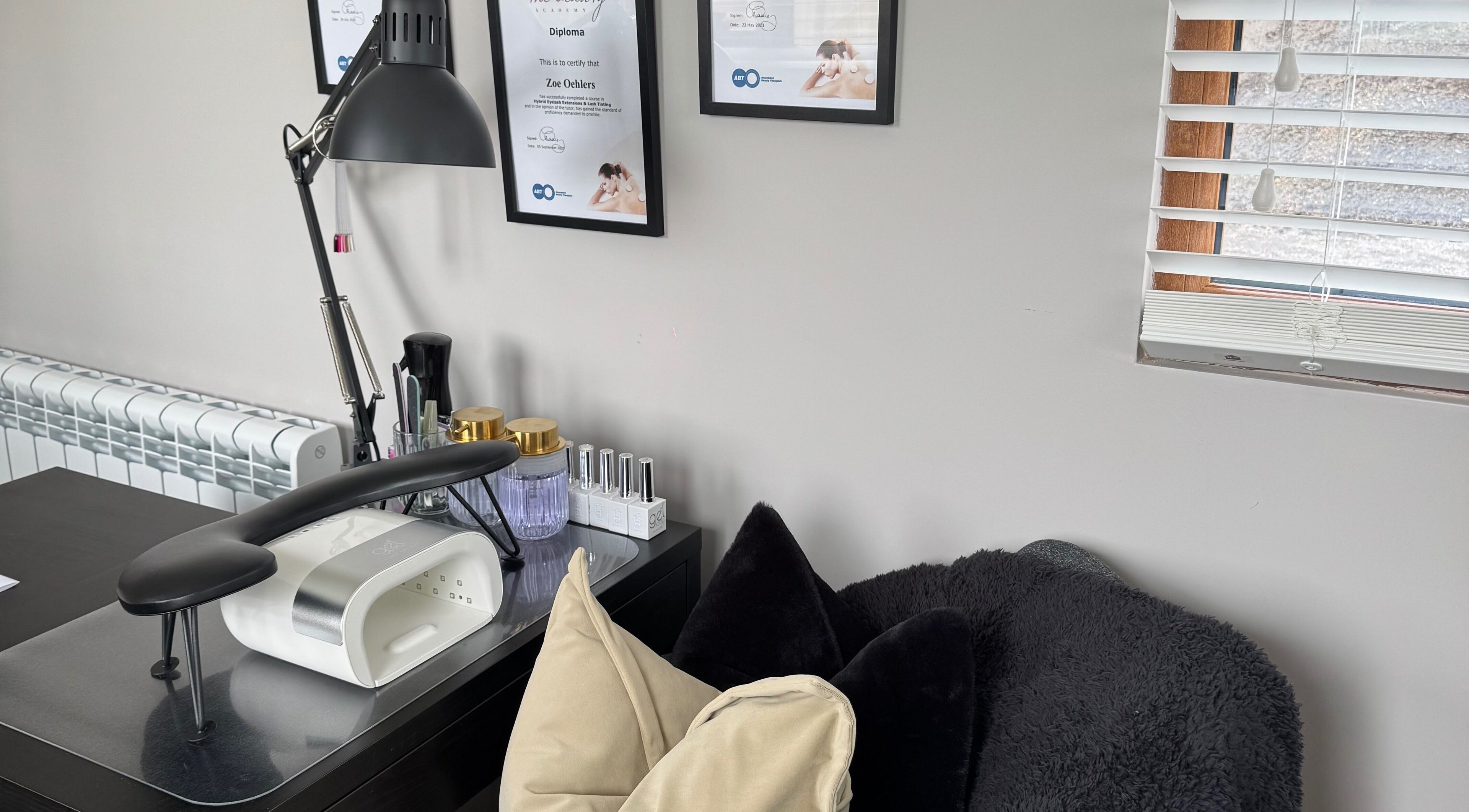 Cozy nail station at Bella Beauty, Bowerhill, England, GB, featuring tools and decor for relaxing services.