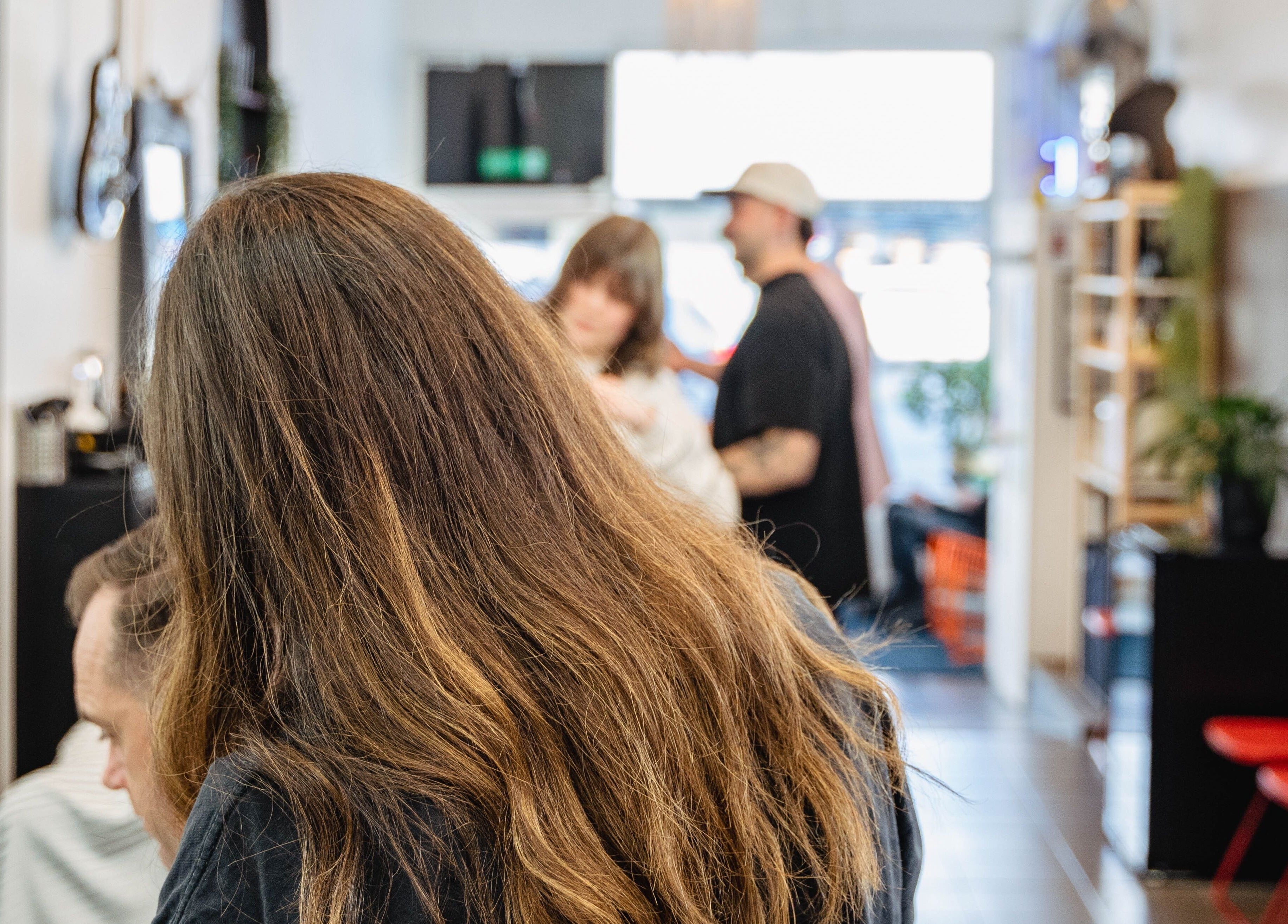 Inside Dark and Stormy Barber Collective in Bendigo, Victoria, AU, patrons enjoy a cozy and vibrant atmosphere.