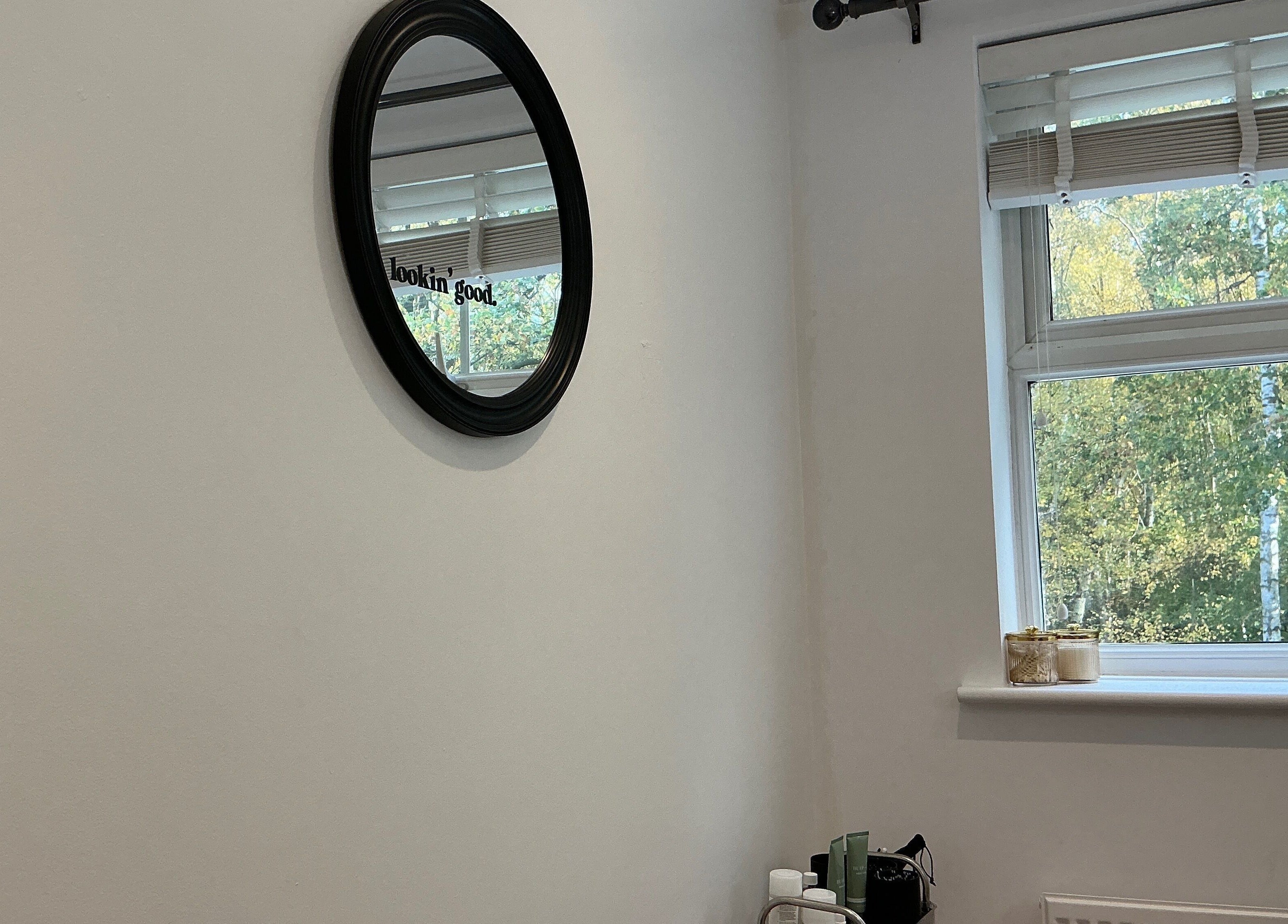 Calm beauty space at Brows by Lauren, Lincoln, England, GB with a wall-mounted mirror and window view.
