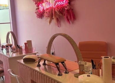 Pink-themed nail station at Nails by Ellie Creed, Helston, England, GB, with stylish decor and manicure tools.