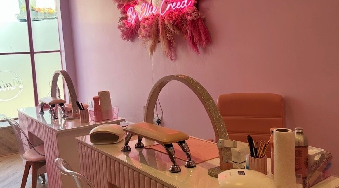 Pink-themed nail station at Nails by Ellie Creed, Helston, England, GB, with stylish decor and manicure tools.