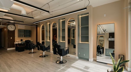 Modern interior of KO CUTZ SALON & SPA in Mississauga, Ontario, CA with stylish chairs and mirrors.