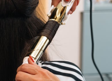Expert hair curling at KO CUTZ SALON & SPA, Mississauga, Ontario, CA for a stunning style.