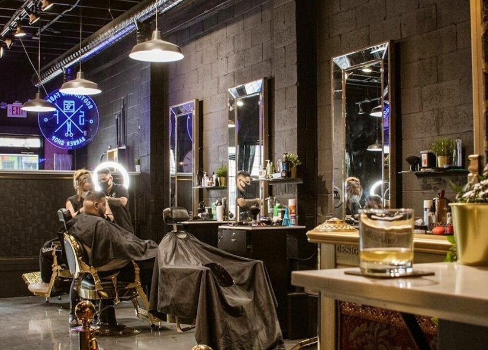 Contemporary interior of Scotch and Fades, a barbershop in Vancouver, British Columbia, CA with stylish decor.