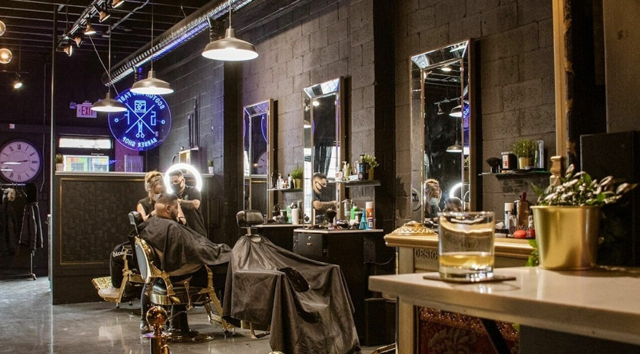 Contemporary interior of Scotch and Fades, a barbershop in Vancouver, British Columbia, CA with stylish decor.
