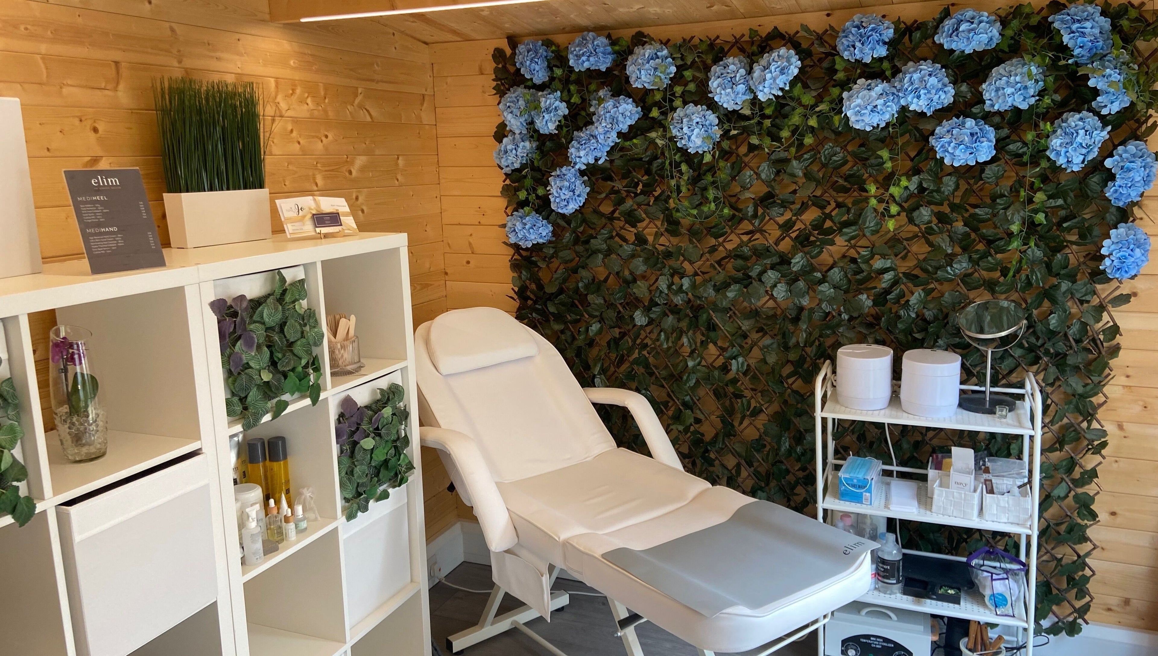Tranquil nail salon at Nails By Jo in Fremington, England, GB, featuring a white chair and floral decor.