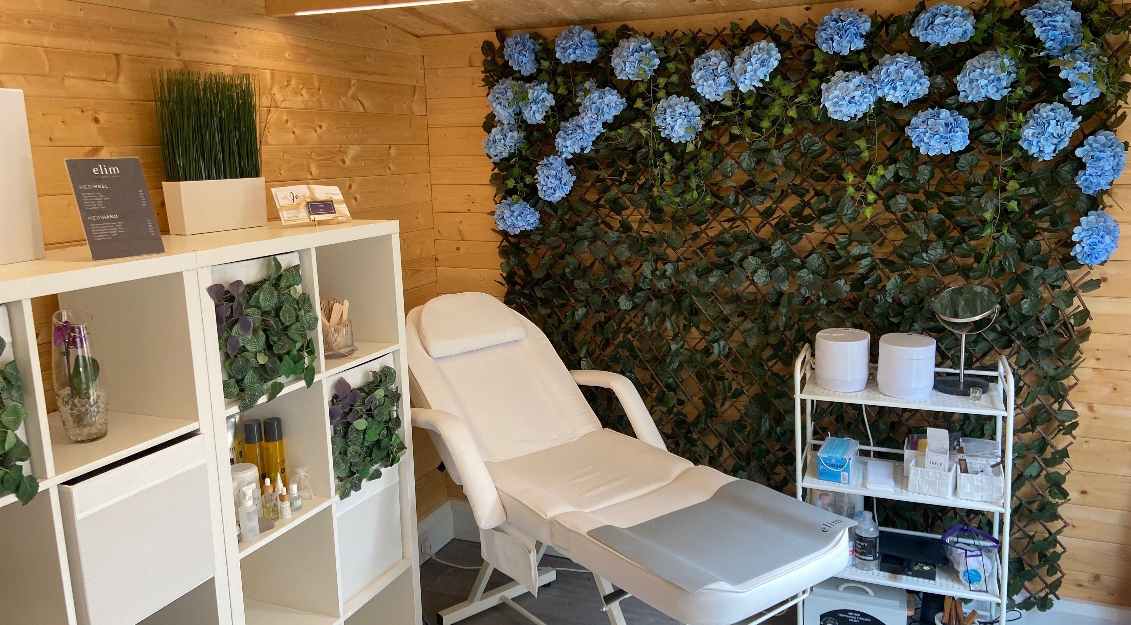 Tranquil nail salon at Nails By Jo in Fremington, England, GB, featuring a white chair and floral decor.