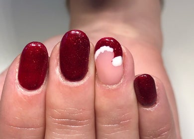 Elegant red glitter nails with trendy design at Nails By Jo, Fremington, England, GB.