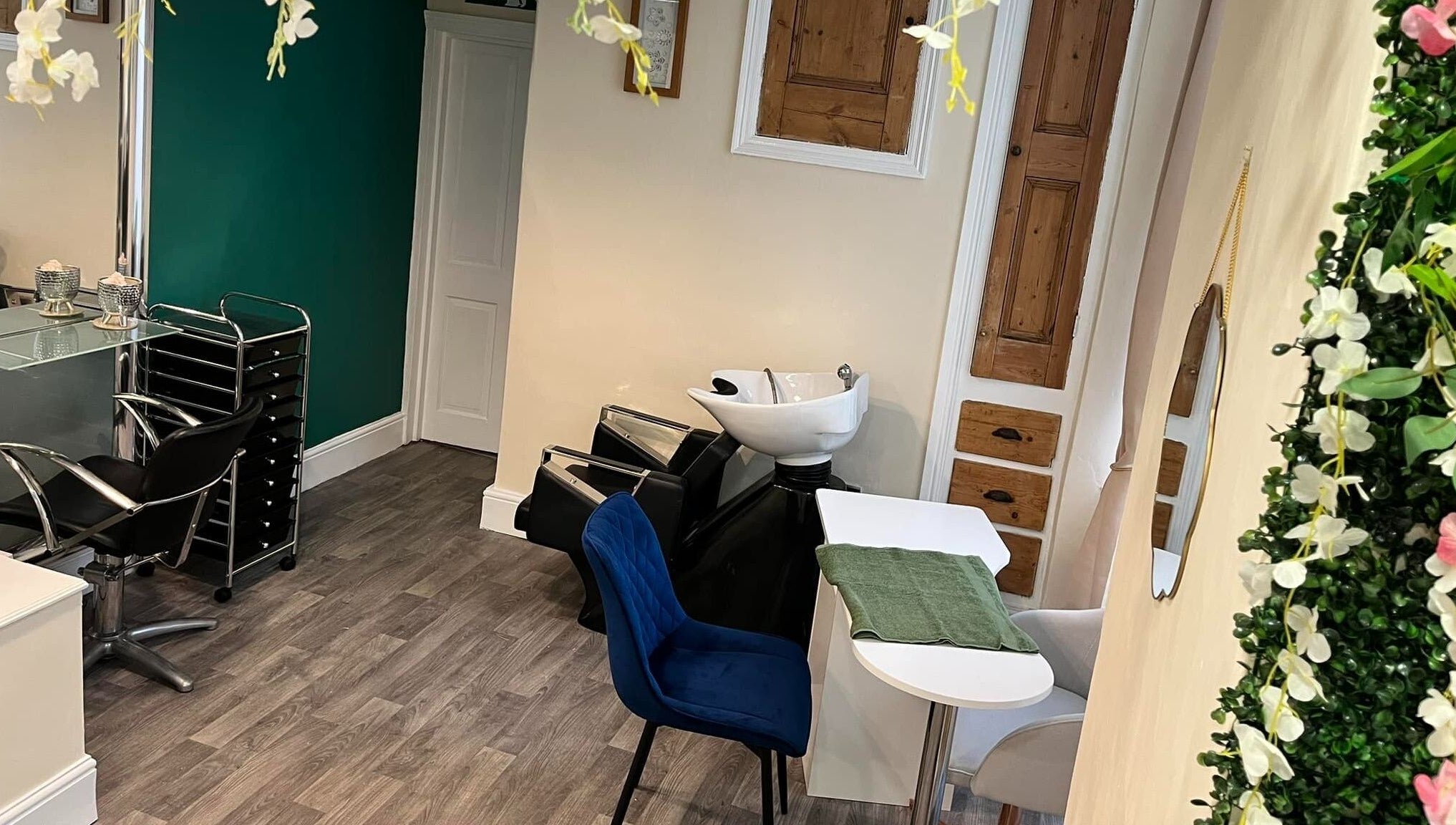 Cozy interior of Blue Moon Nails and Beauty, Hull, England, GB with elegant salon chairs and floral decor.