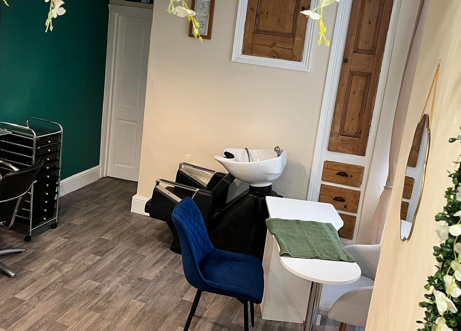 Cozy interior of Blue Moon Nails and Beauty, Hull, England, GB with elegant salon chairs and floral decor.
