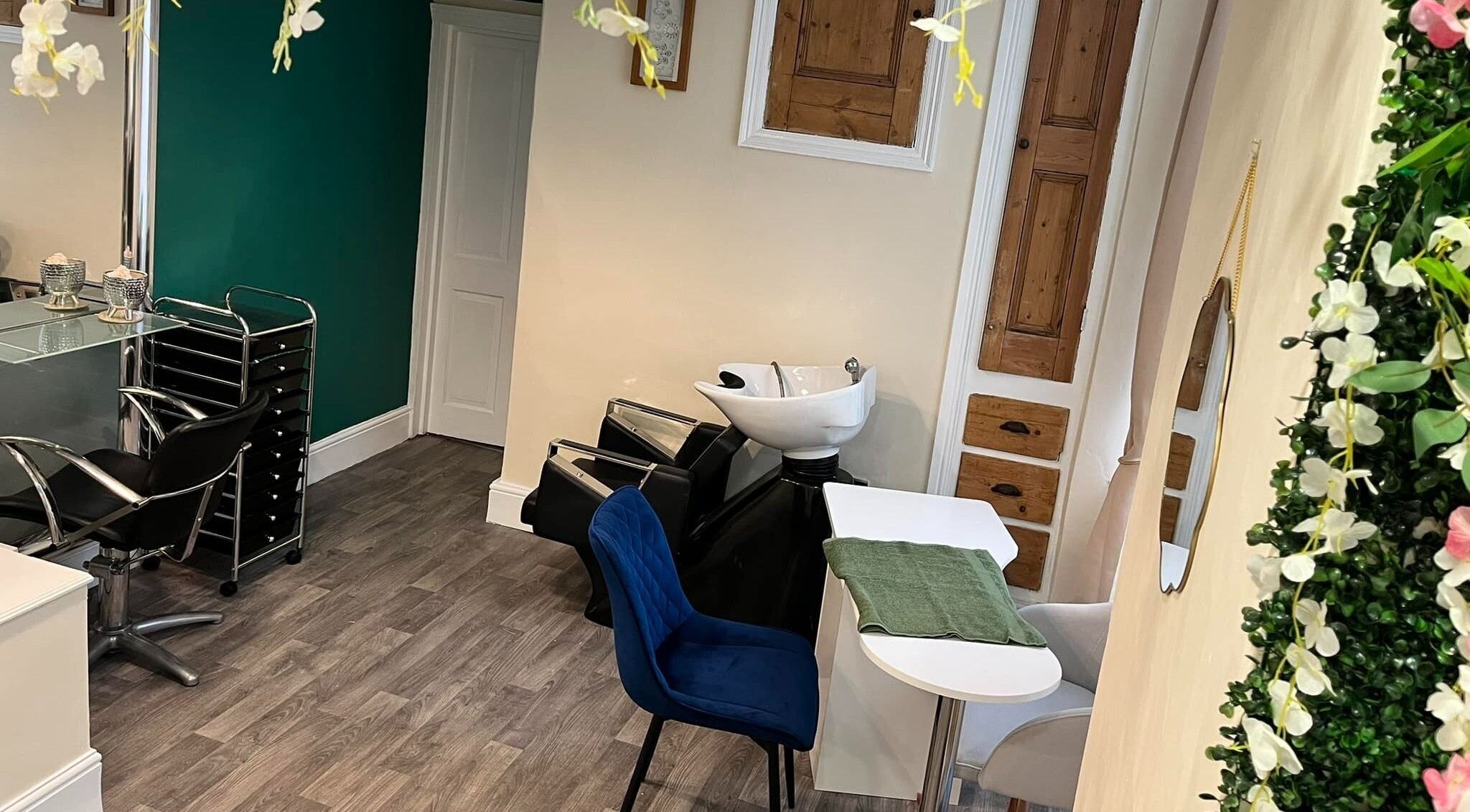 Cozy interior of Blue Moon Nails and Beauty, Hull, England, GB with elegant salon chairs and floral decor.