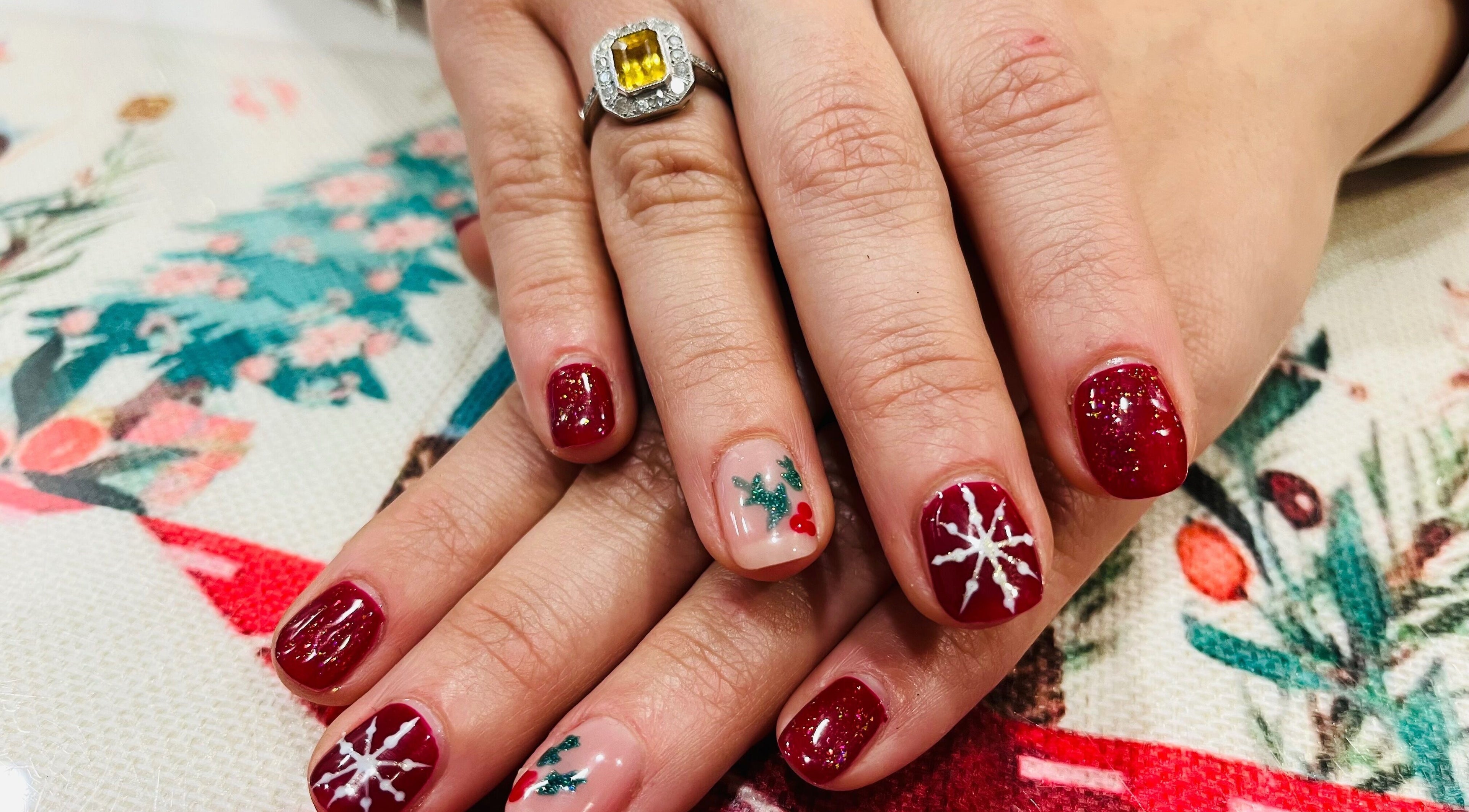 Festive nail art at Blue Moon Nails and Beauty in Hull, England, GB featuring red and white designs.