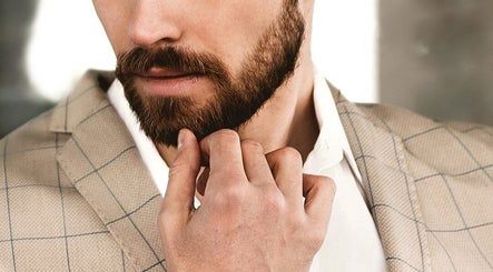 Close-up of a well-groomed man in a suit, epitomizing style at Beautiology, Auckland, NZ.